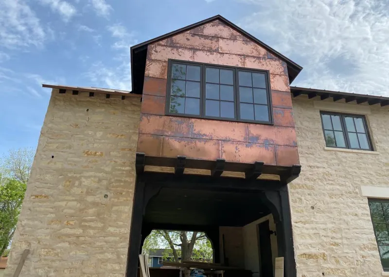 Copper metal panel facade on a stone building for Metal Roof Coating in North College Hill