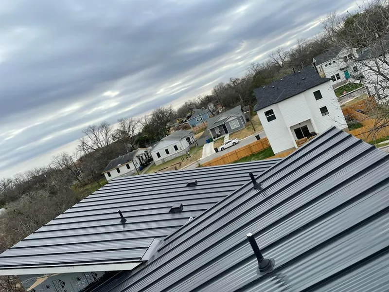 Standing seam metal roof panels with vents for Skylight Repair in North College Hill